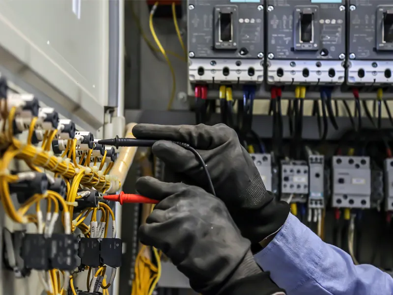 Electric eningeer checking electric distribution